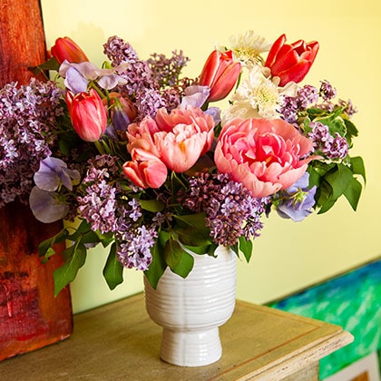 May lilac mixed with sweet peas, tulips and peonies is a favorite flower combination for Spring.
