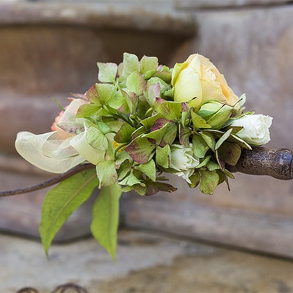 Small floral detail augments this wire basket handle.